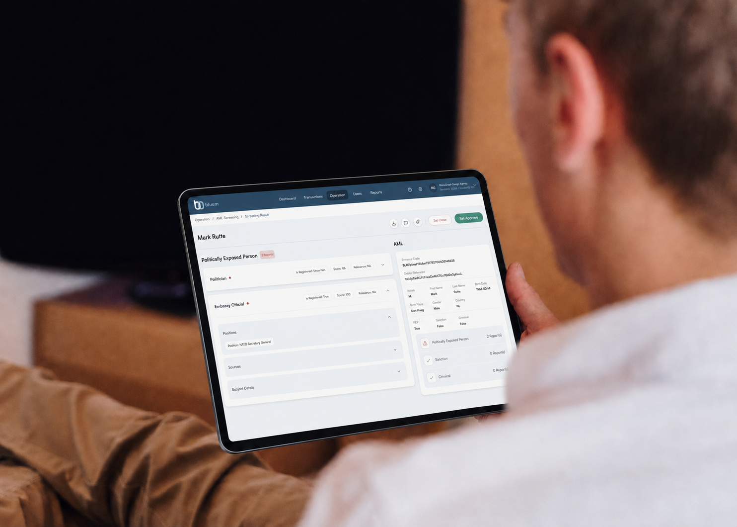 Compliance officer reviewing a PEP screening result in Bluem on a tablet