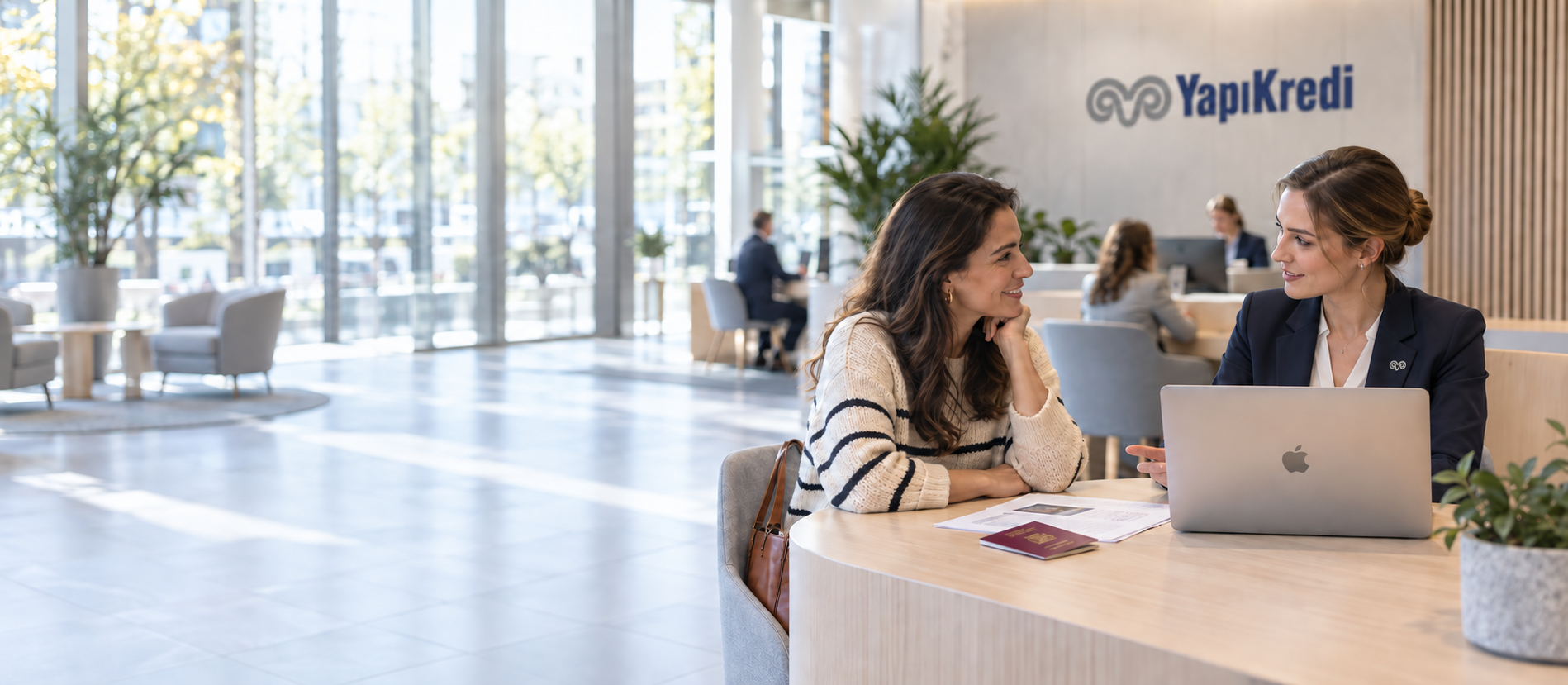 Bank advisor helping a customer open an account at a branch desk