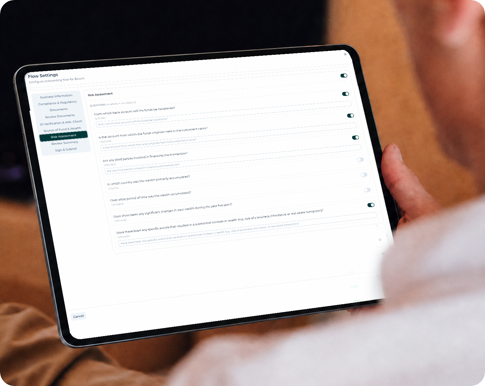 Person holding a tablet showing the NeoBoarding flow settings screen