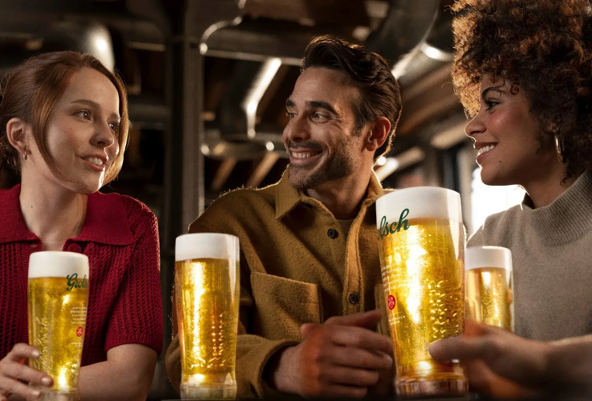 Man smiling with a glass of beer