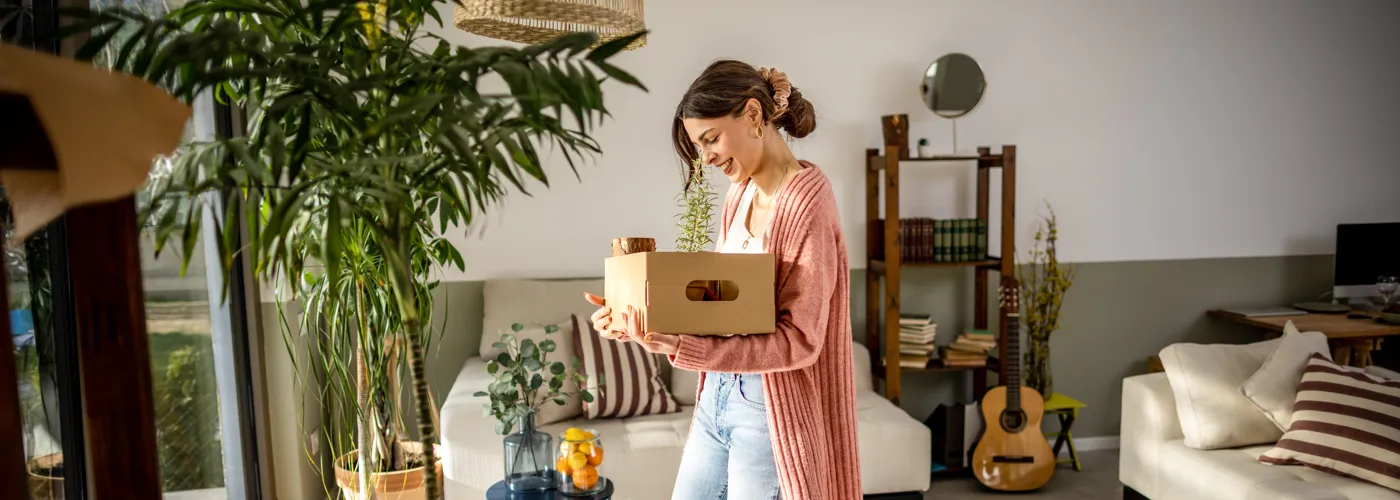 Woman holding a moving box